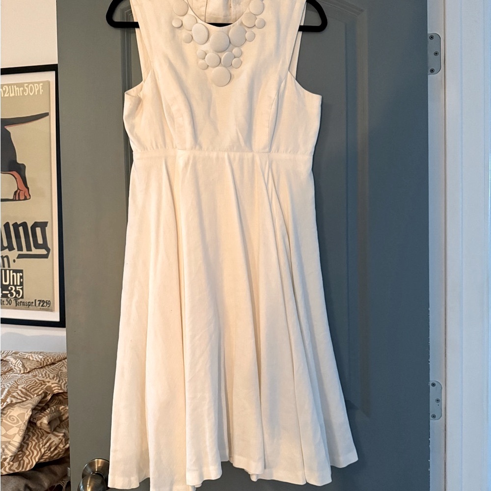 White Milly dress, back cut-out, midi length, sleeveless.